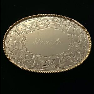 Montana Silversmiths oval western belt buckle engraved with Pearle and filigree